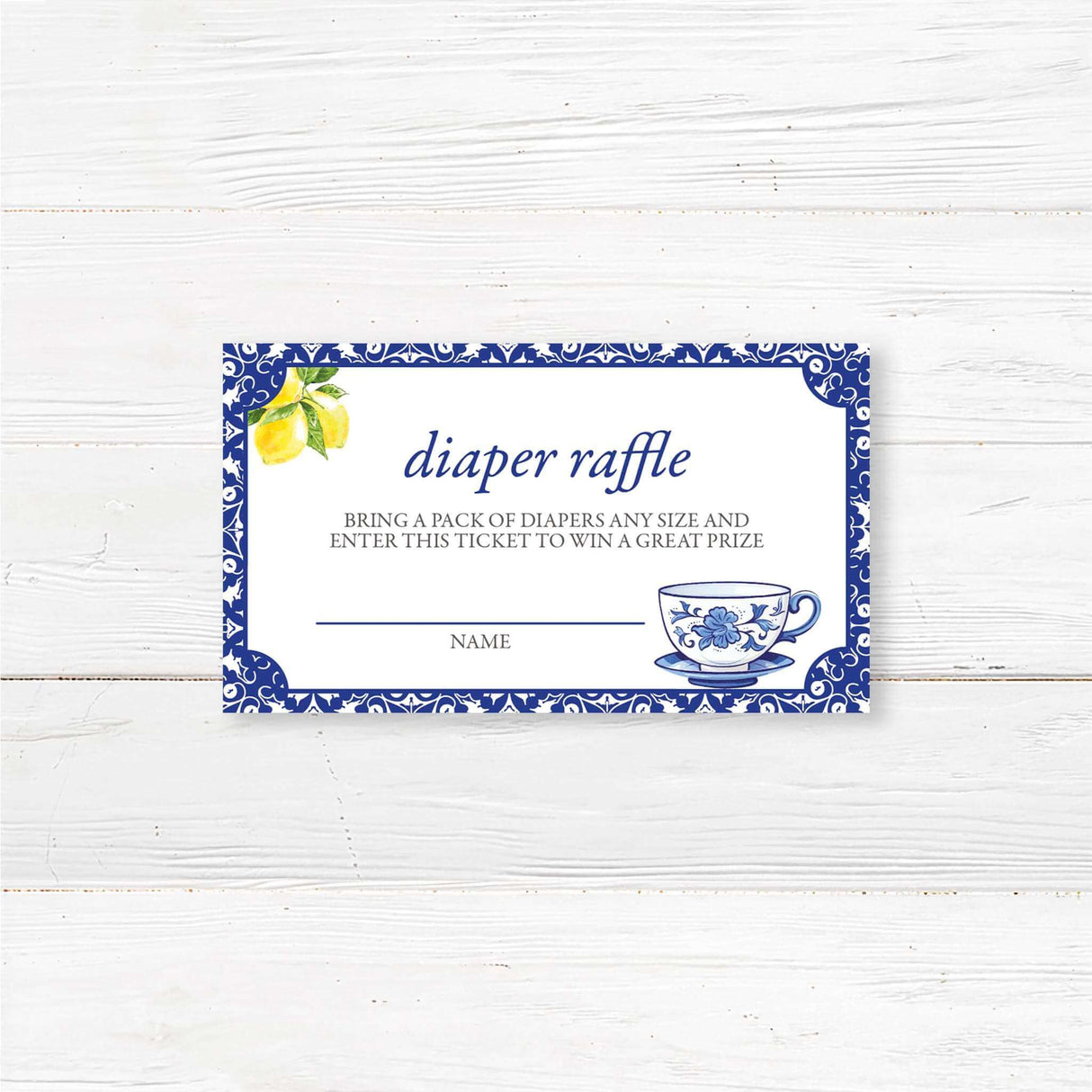 Baby shower diaper raffle ticket featuring a blue floral tea cup and lemons, designed for a fun and elegant tea party-themed shower.