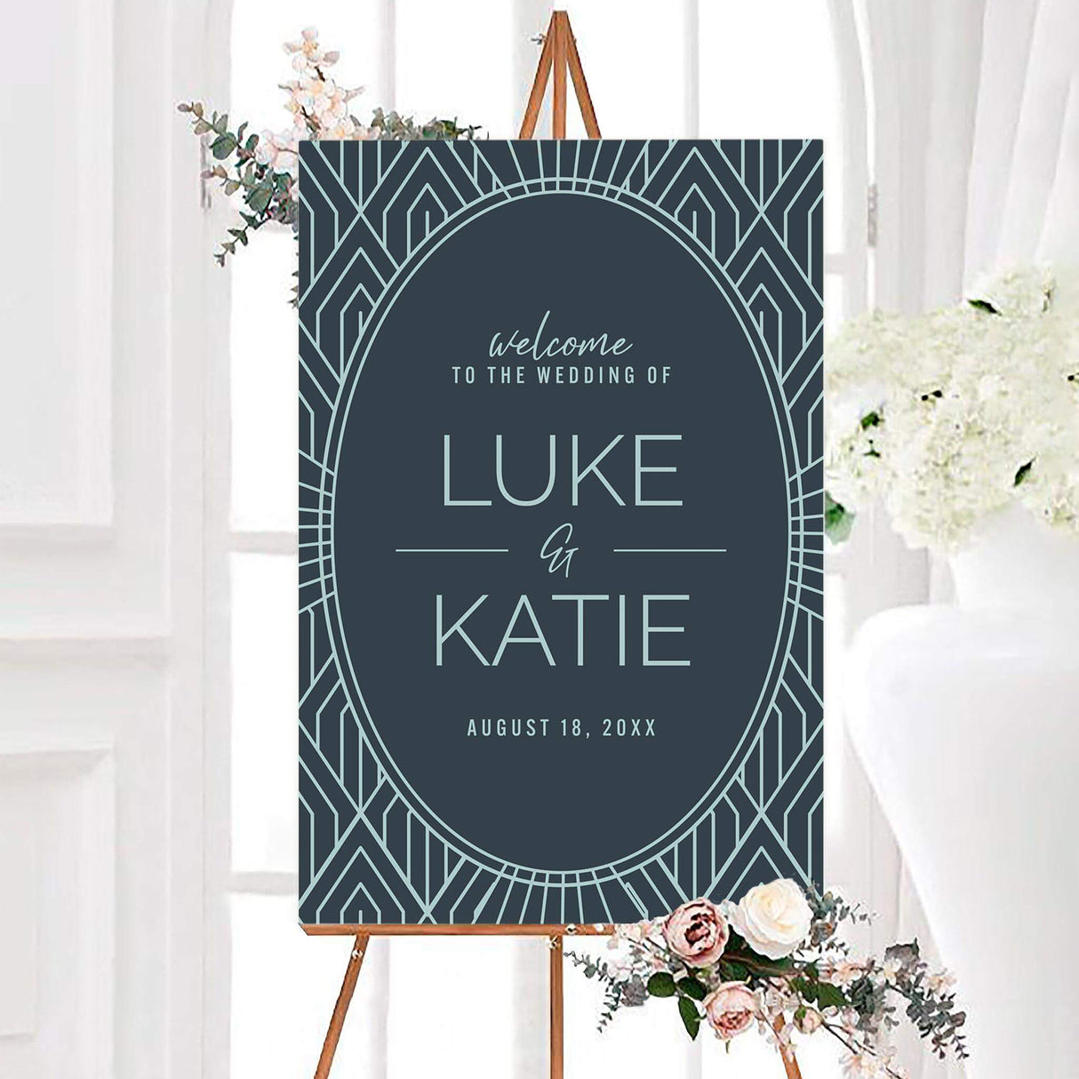 Teal art deco wedding welcome sign with a pale blue geometric border and large oval center frame. Personalized couple names and wedding date appear in elegant modern typography.
