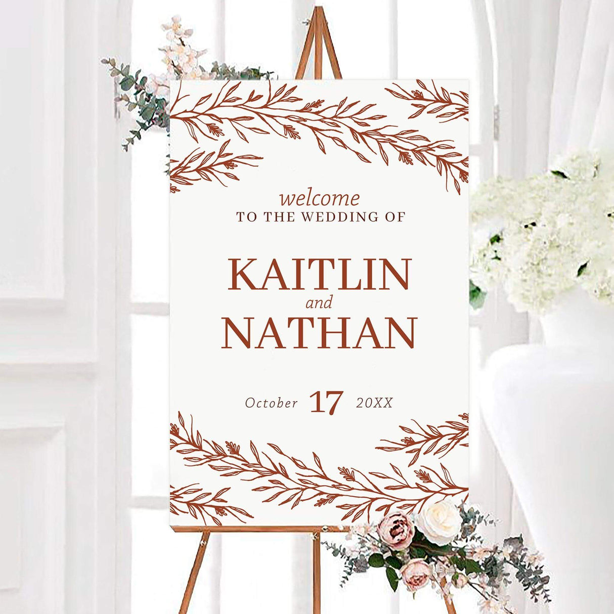 Botanical terracotta foliage wedding welcome sign featuring hand-drawn leafy branches, personalized couple’s names, and a custom wedding date. The earthy design creates a warm, rustic look for a wedding entrance.