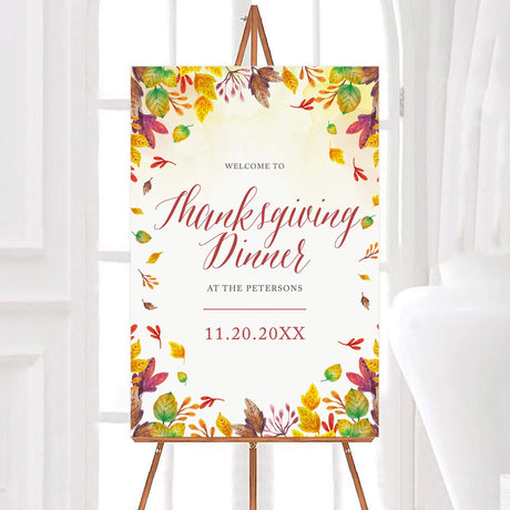 Elegant Thanksgiving Dinner invitation with autumn leaves border and personalized family event details on a display board.