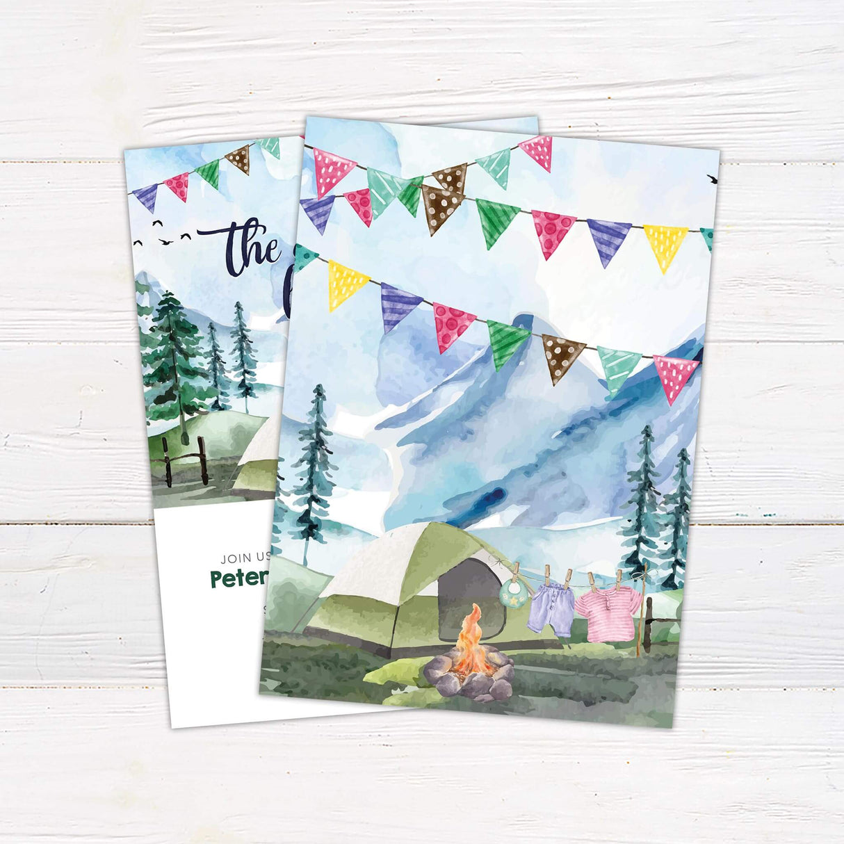 Rustic baby shower welcome sign featuring a watercolor camping scene with mountains, a tent, a campfire, and baby clothes on a clothesline. A perfect choice for adventure-themed, outdoor, or woodland baby showers.