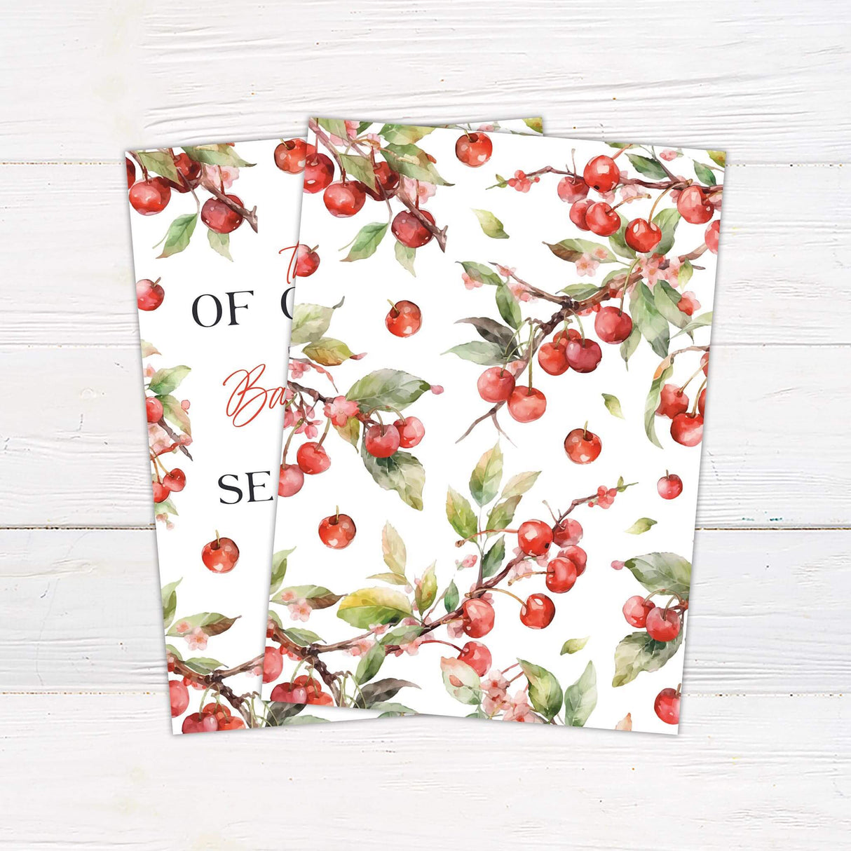 Shower invitation featuring a charming apple and cherry blossom theme. The design includes elegant script and serif fonts with the phrase "The apple of our eye" at the top. Surrounding the text are watercolor-style illustrations of red apples, cherries, and green leaves. The invitation includes event details such as the honorees' names, date, time, location, and registry information. The nature-inspired aesthetic creates a warm and inviting feel, perfect for celebrating a new arrival. Back.