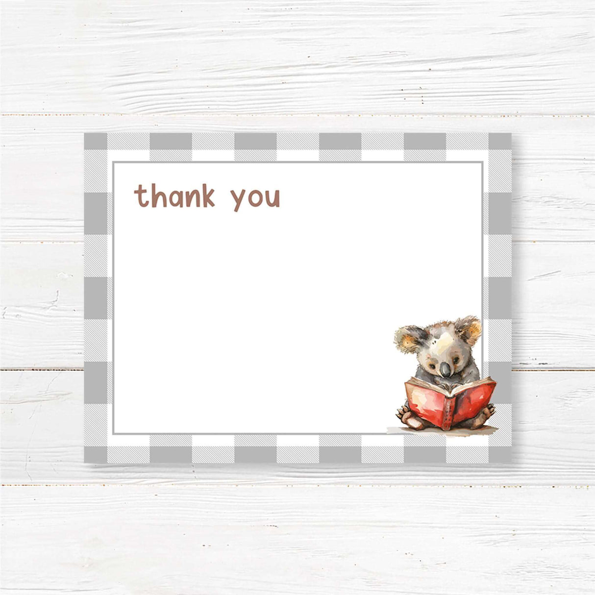 A simple thank you card featuring a watercolor koala reading a red book, set against a neutral buffalo plaid background. Text reads "The Next Chapter is about to begin," with customizable event details. Perfect for literary or woodland-themed celebrations.