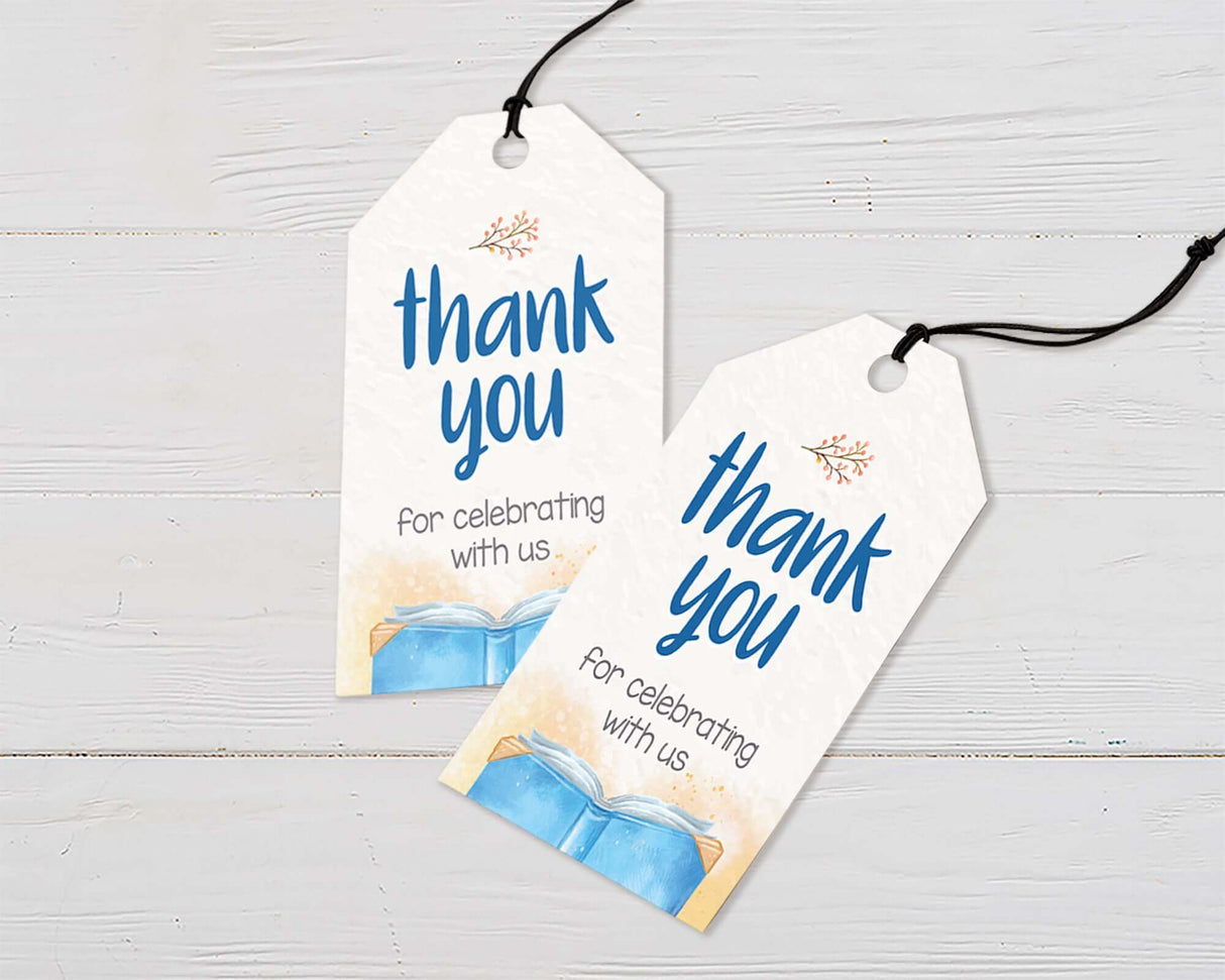 Thank you tags on a light wood background, featuring 'Thank you for celebrating with us' in elegant blue and orange typography.
