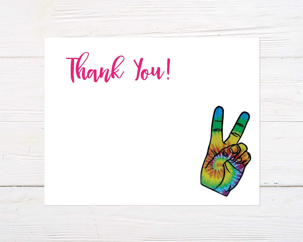 A thank-you card features bright pink "Thank You!" text in a playful script font at the top left, and a colorful tie-dye peace sign hand on the bottom right. The background is white, leaving ample space for a personalized message.