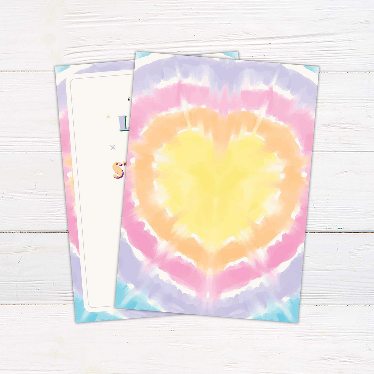 Colorful tie dye wedding invitation with pastel rainbow watercolor border, retro fonts, peace signs, and starburst accents for a playful boho vibe. - back side