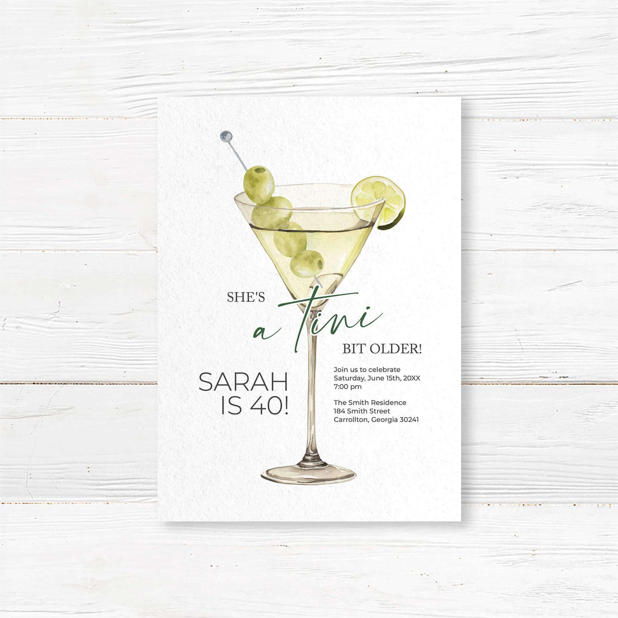 Birthday party invitation featuring a watercolor martini glass with green olives and lime, playful script and serif fonts, and text that reads “She’s a tini bit older,” ideal for cocktail-themed birthday parties.