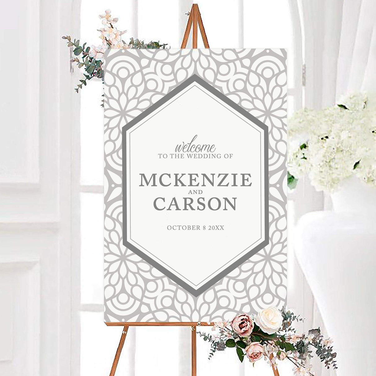 Welcome sign with taupe trellis border and modern serif font for a refined entrance.