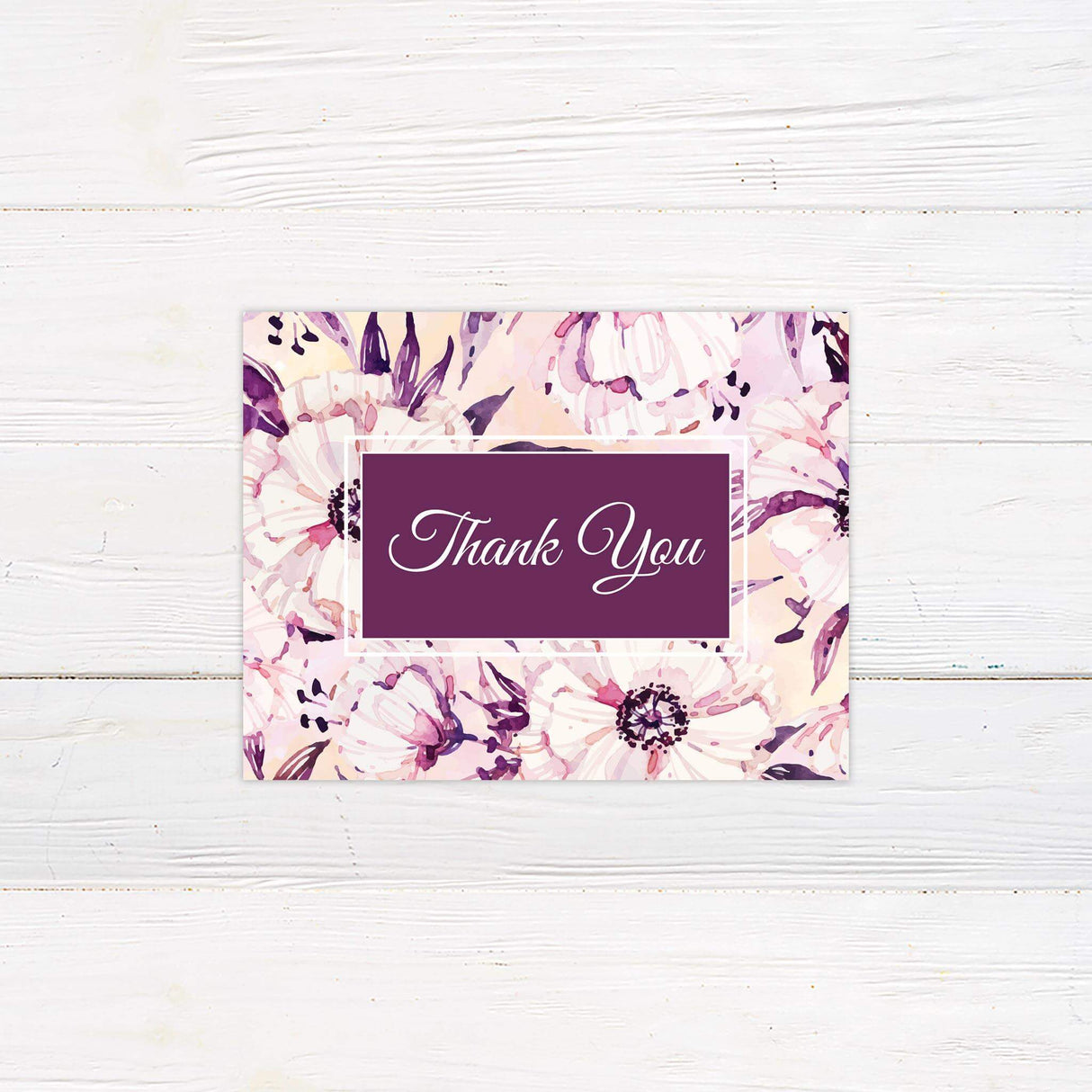 Thank you card with expressive watercolor florals and romantic script font.