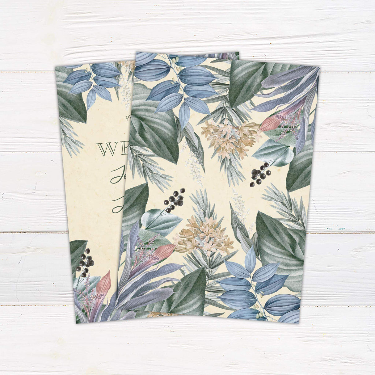 Watercolor tropical floral wedding invitation with pastel leaves, romantic script and serif fonts on a creamy textured background.- back side