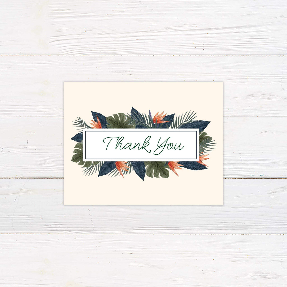 Tropical thank you card with coordinating palm leaves and floral accents.