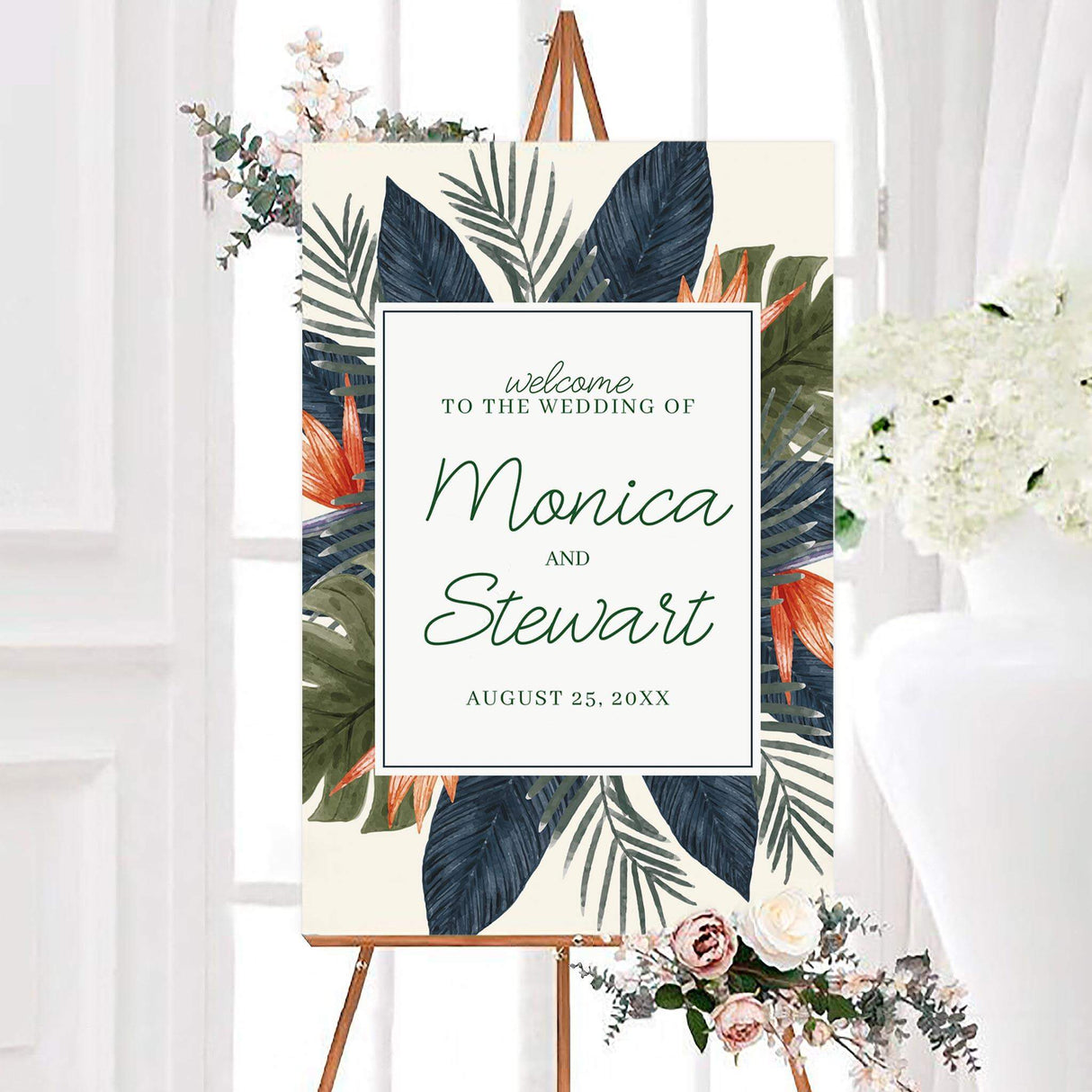 Tropical love wedding welcome sign featuring lush watercolor leaves, exotic flowers, and personalized couple names in elegant script. A framed white center displays the wedding message and custom date.