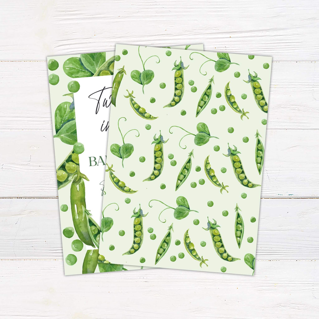 Two Peas in a Pod baby shower invitation with watercolor pea pod design on a soft green background, perfect for twins announcement.