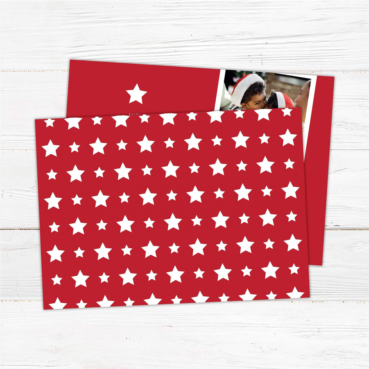 Two photo collage Christmas card with red background, white star accent, and personalized holiday greeting with family portraits. - back.