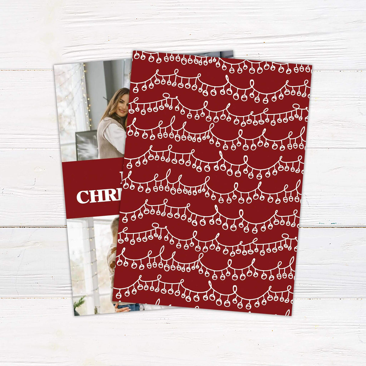 Holiday card with two family photos and a bold red banner reading “Merry Christmas” with family name and year.
A festive Christmas photo card featuring two picture spaces and a central holiday greeting in red and white. - back.