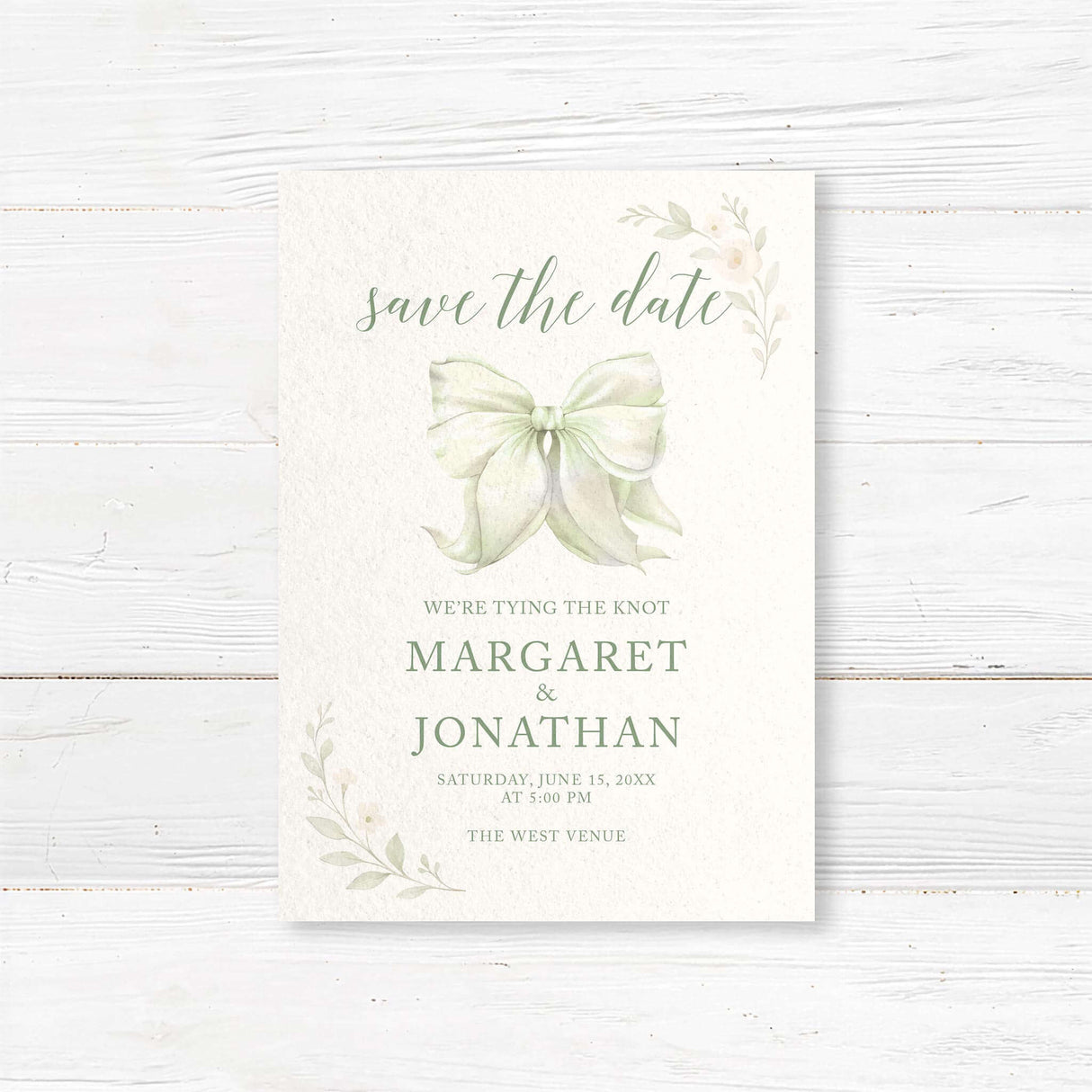 Save the date card with tying the knot bow and soft floral design