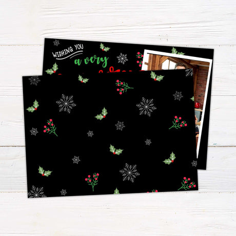 Very Merry Christmas card with black background, red and green festive lettering, three family photos, and personalized holiday greeting. - back.