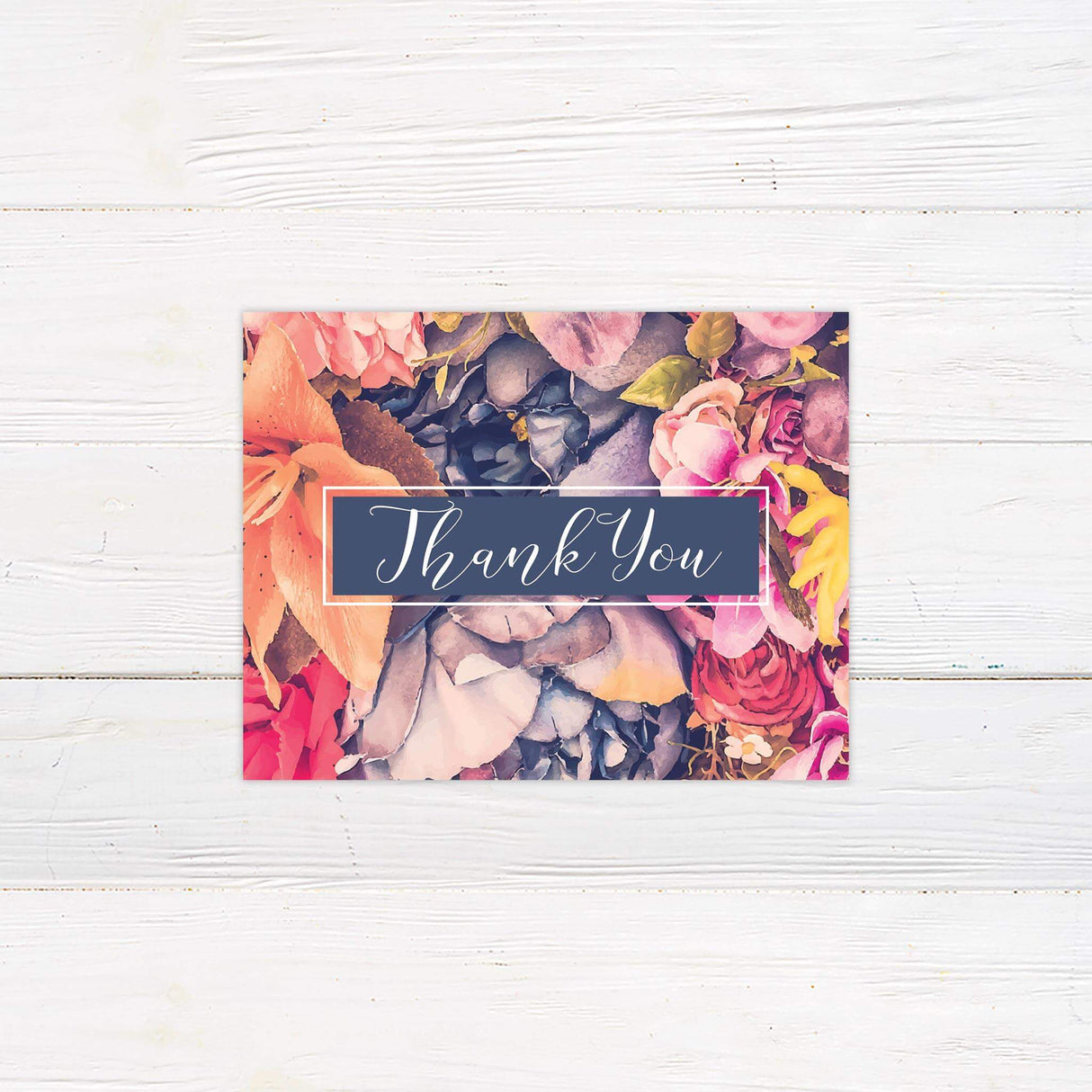 Thank you card featuring coordinating pink, coral, and navy floral design with script font.