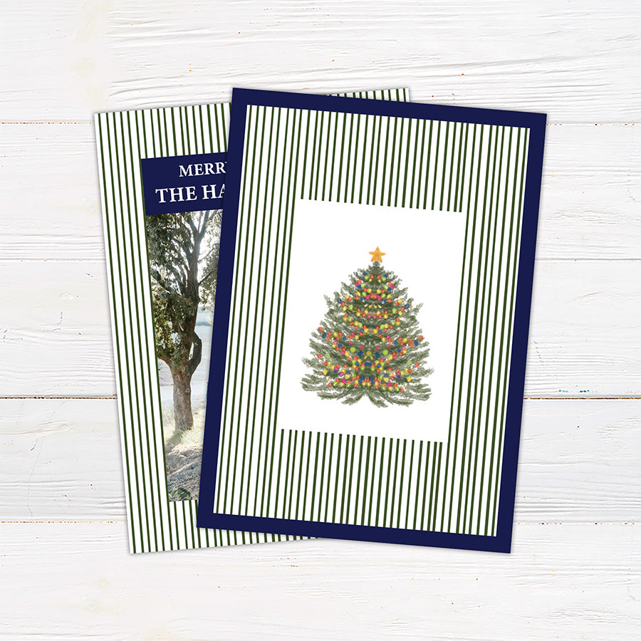 Personalized family Christmas photo card featuring a classic striped border, large family photograph, Merry Christmas greeting, and custom family name. The coordinating back features a decorated Christmas tree framed by matching pinstripes.