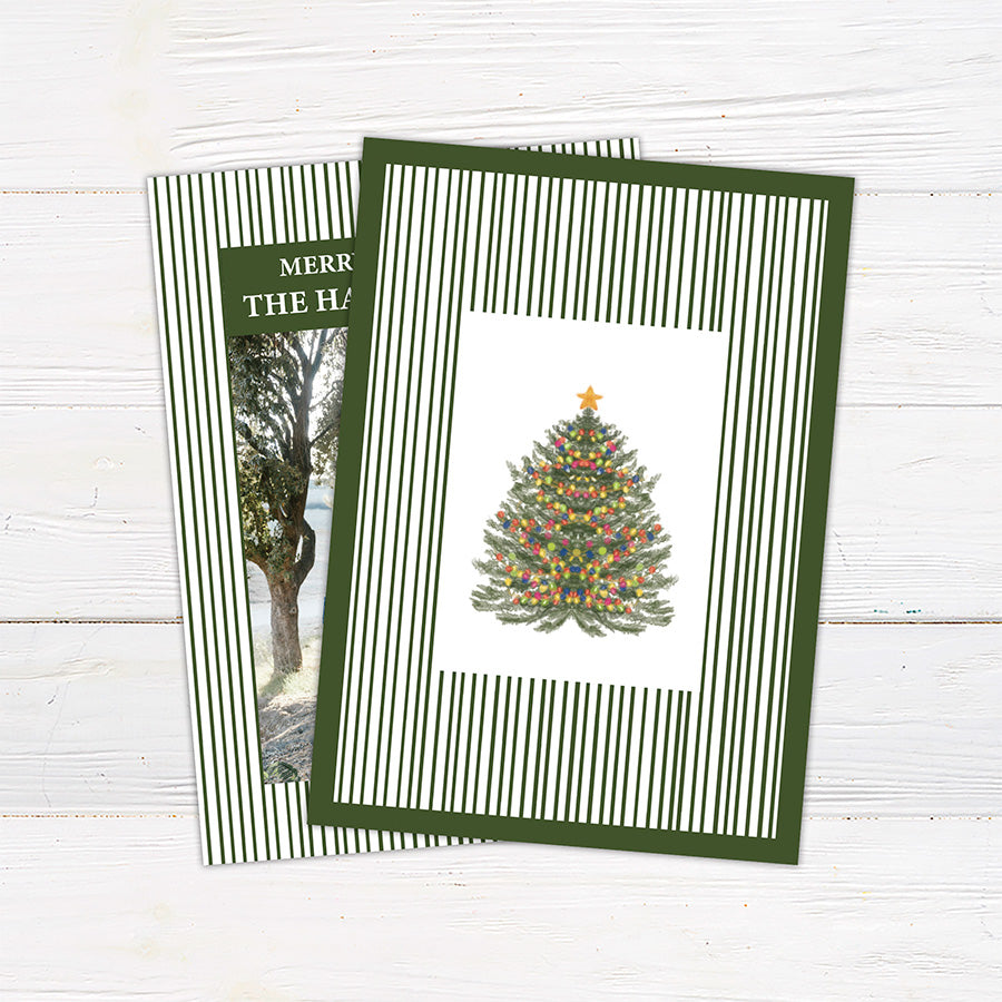 Personalized family Christmas photo card featuring a classic striped border, large family photograph, Merry Christmas greeting, and custom family name. The coordinating back features a decorated Christmas tree framed by matching pinstripes.