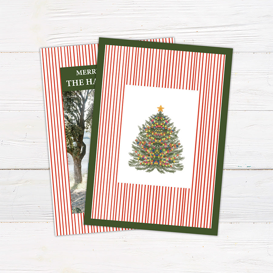 Personalized family Christmas photo card featuring a classic striped border, large family photograph, Merry Christmas greeting, and custom family name. The coordinating back features a decorated Christmas tree framed by matching pinstripes.