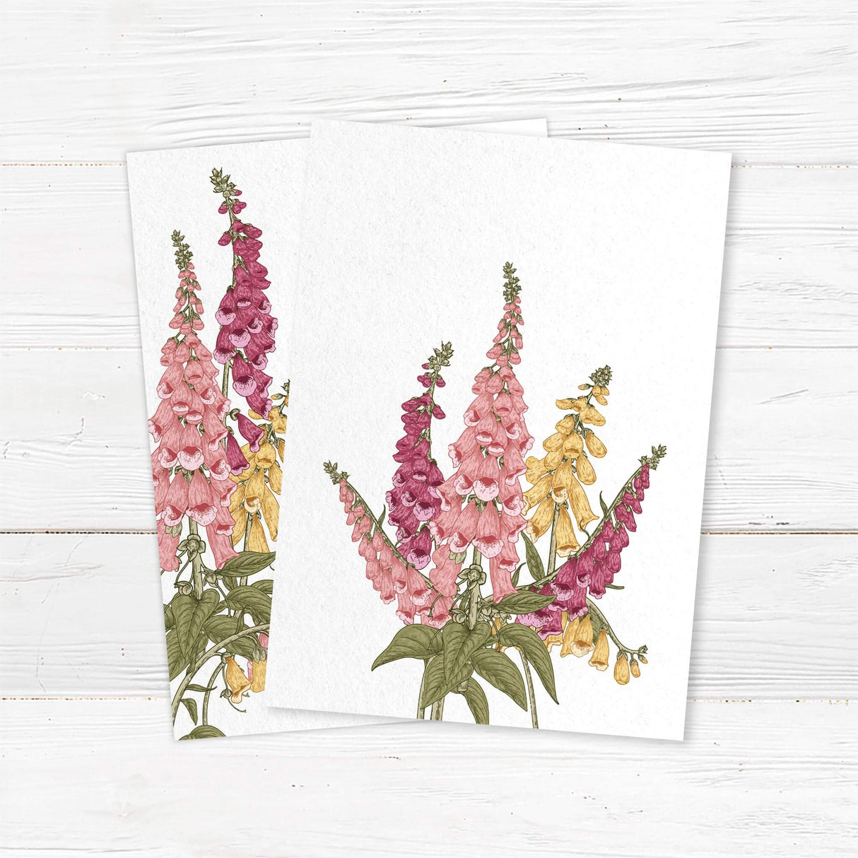 Wedding invitation with watercolor foxglove flowers in pink, burgundy, and gold, elegant serif fonts, and textured white background. Vintage botanical design. back