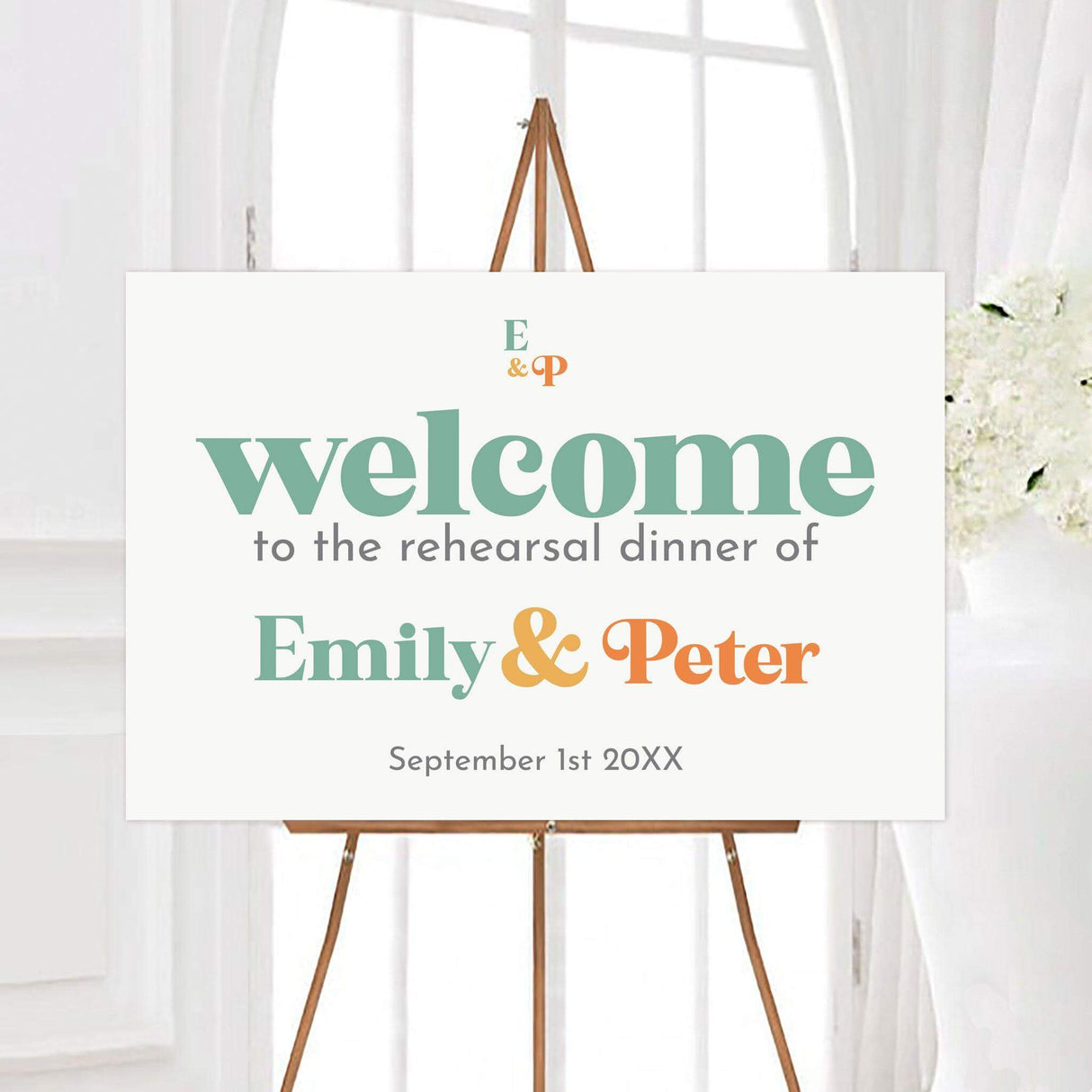 Printed wedding welcome sign with colorful modern fonts and retro styling, designed to coordinate with the full invitation suite.