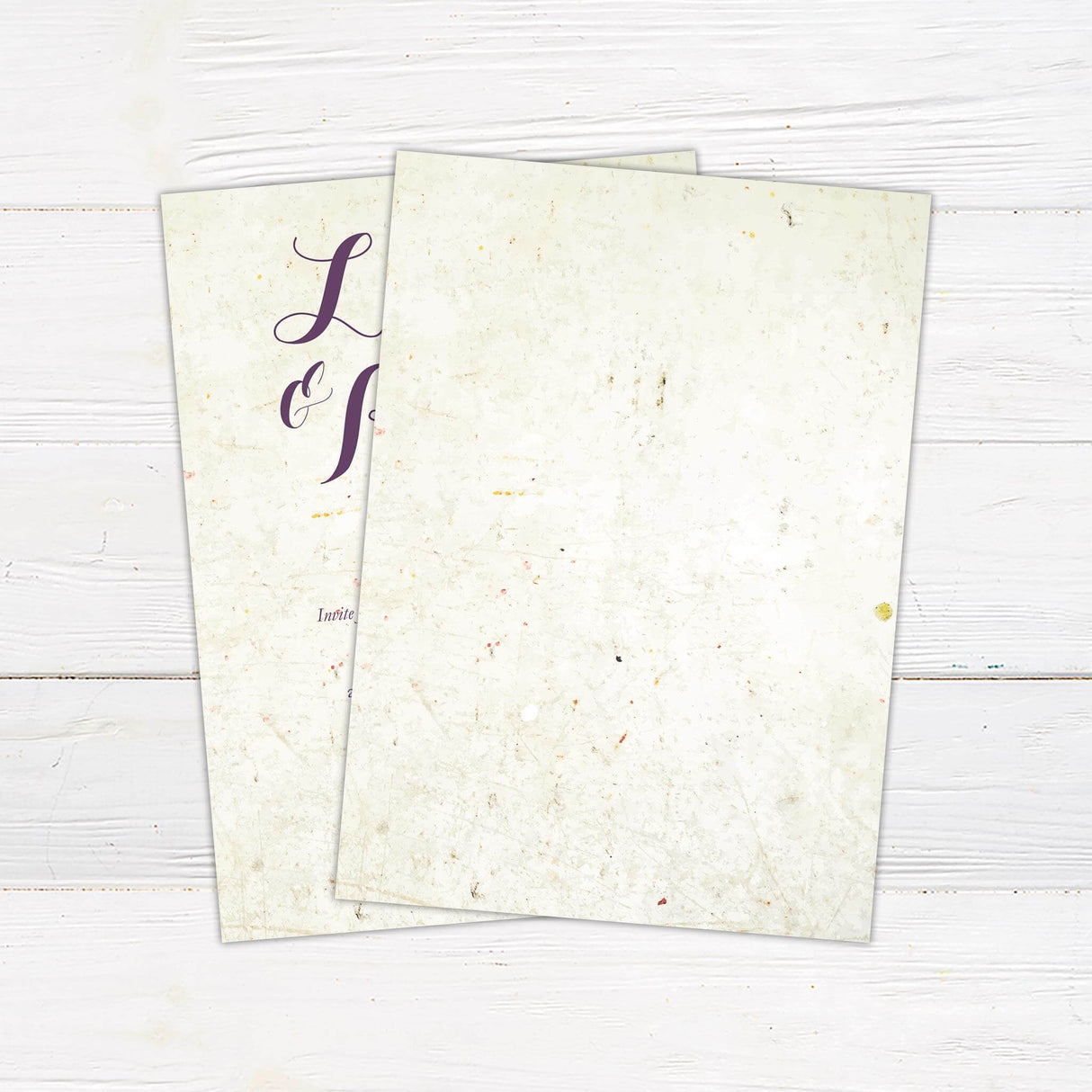 Rustic wedding invitation with aged paper background and elegant purple script fonts. Back.