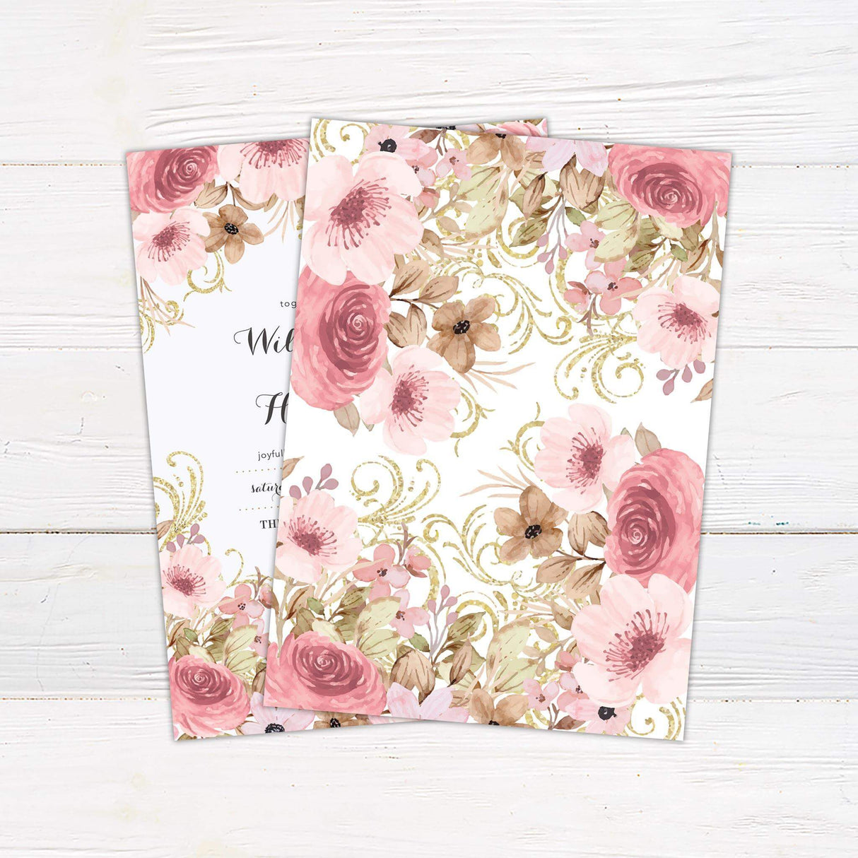 Wedding invitation with vintage blush pink florals, soft greenery, and faux gold swirls on white background with elegant script and serif fonts.- back side