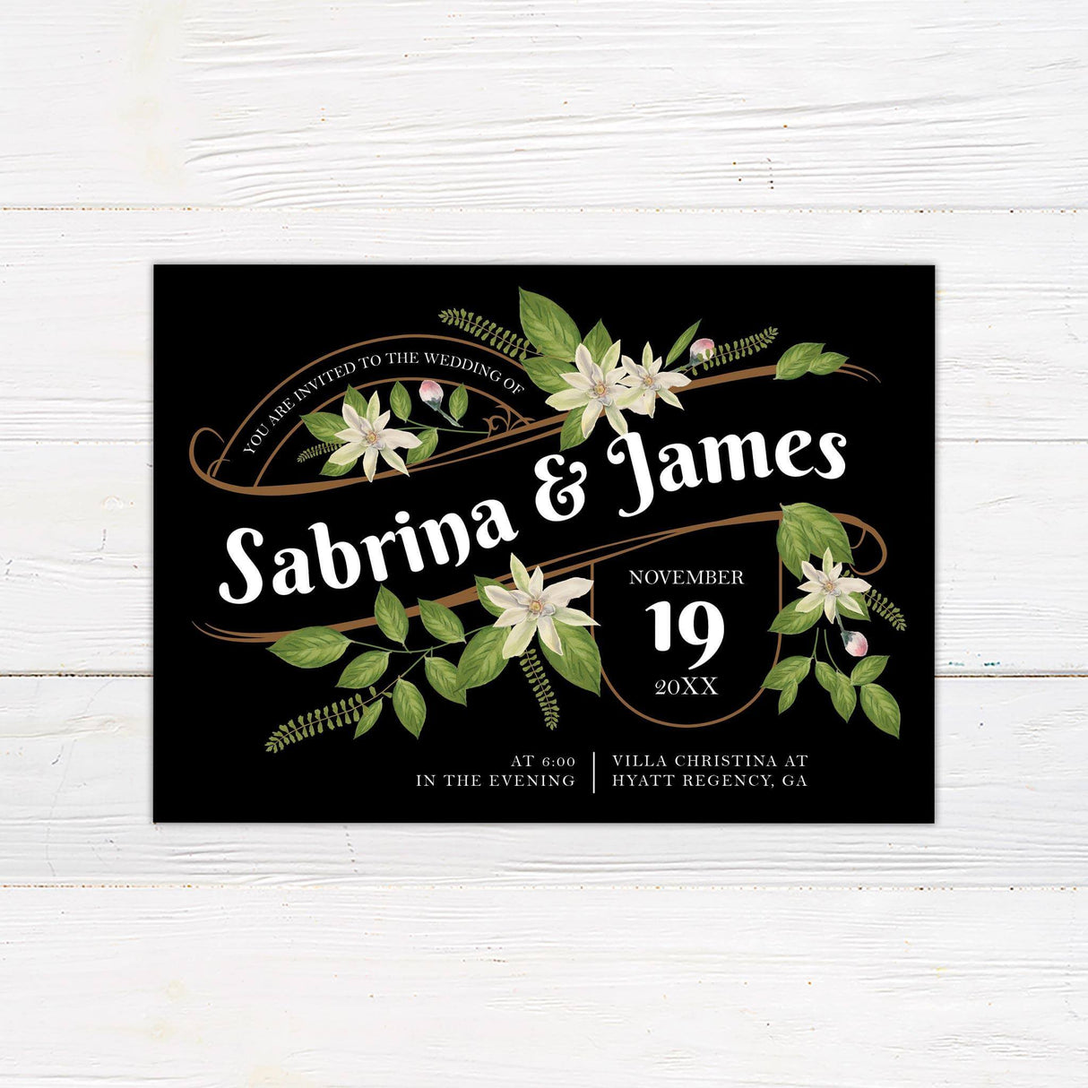 Dark background wedding invitation featuring white vintage flowers, green foliage, and elegant copper scrollwork with serif and script fonts.