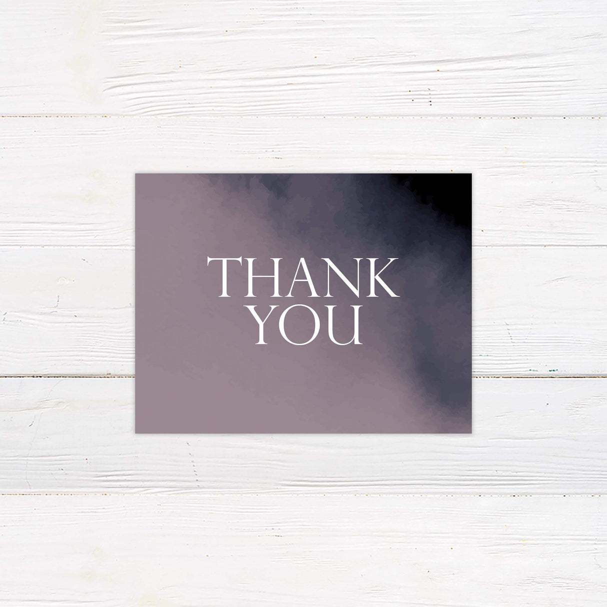 Thank you card with violet watercolor wash and graceful handwritten thank you message.