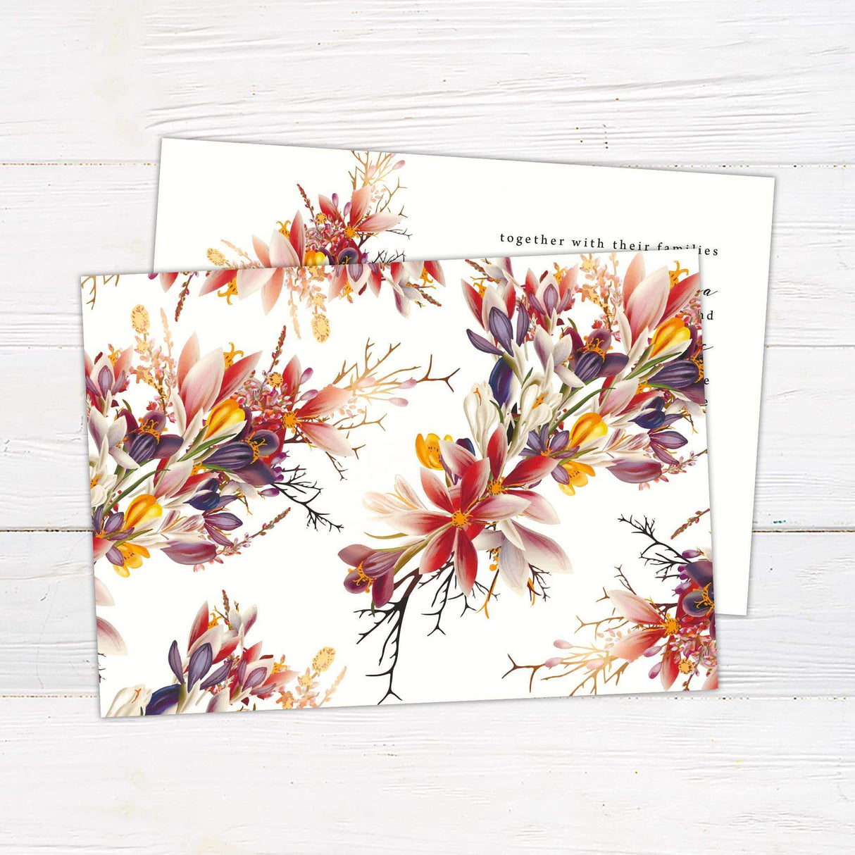 Elegant wedding invitation featuring a vivid floral arrangement in rich autumn hues of red, orange, and purple. A modern layout with calligraphy-style script, perfect for fall, rustic, or botanical weddings. Back.