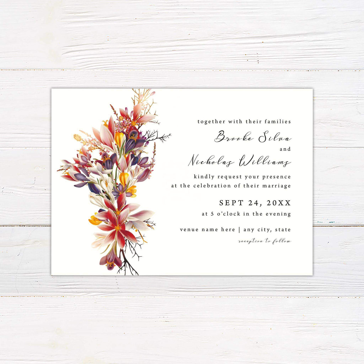 Elegant wedding invitation featuring a vivid floral arrangement in rich autumn hues of red, orange, and purple. A modern layout with calligraphy-style script, perfect for fall, rustic, or botanical weddings.