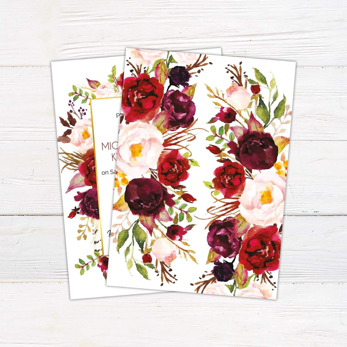 Wedding invitation with deep red, burgundy, blush, and ivory watercolor florals framing a white text box with modern script. Back.
