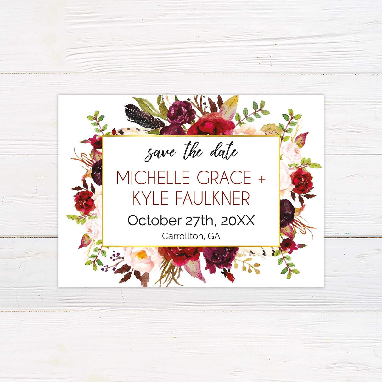 Save the date card with deep red, burgundy, blush, and ivory watercolor florals framing a white text box with modern script.