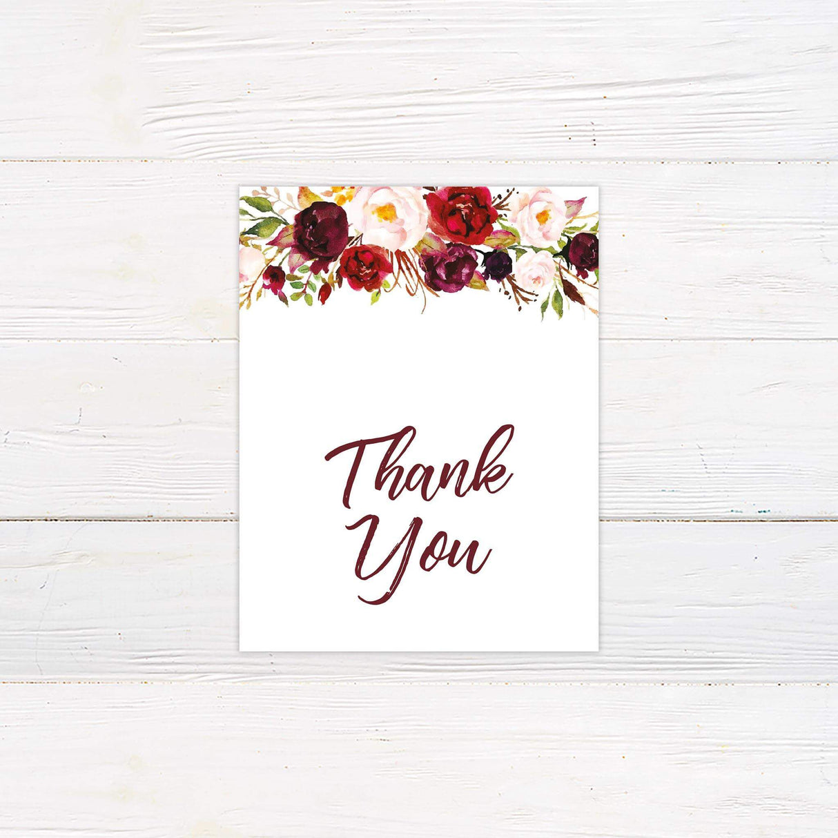 Thank you card with deep red, burgundy, blush, and ivory watercolor floral accent and modern script.
