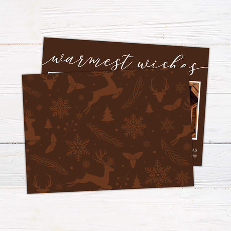 Modern Warmest Wishes Christmas card with two family photo collage, chocolate brown background, handwritten script, and festive holiday greeting. back side