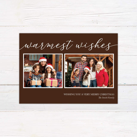 Modern Warmest Wishes Christmas card with two family photo collage, chocolate brown background, handwritten script, and festive holiday greeting.