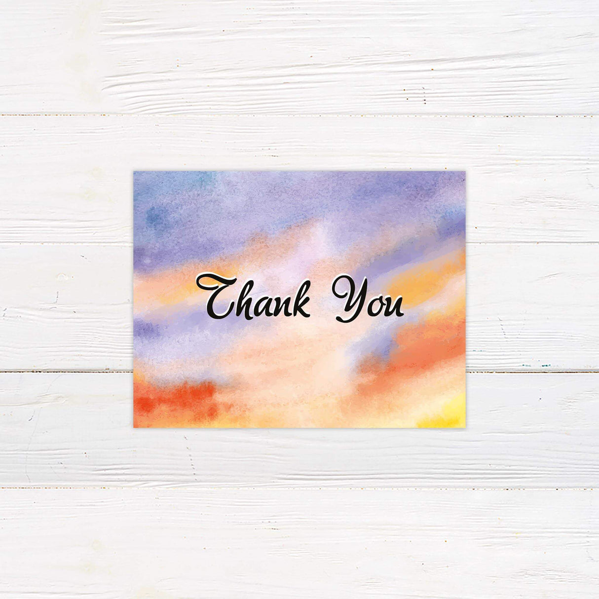 Thank you card with watercolor lake and sunset sky in orange, purple, and pastel hues.