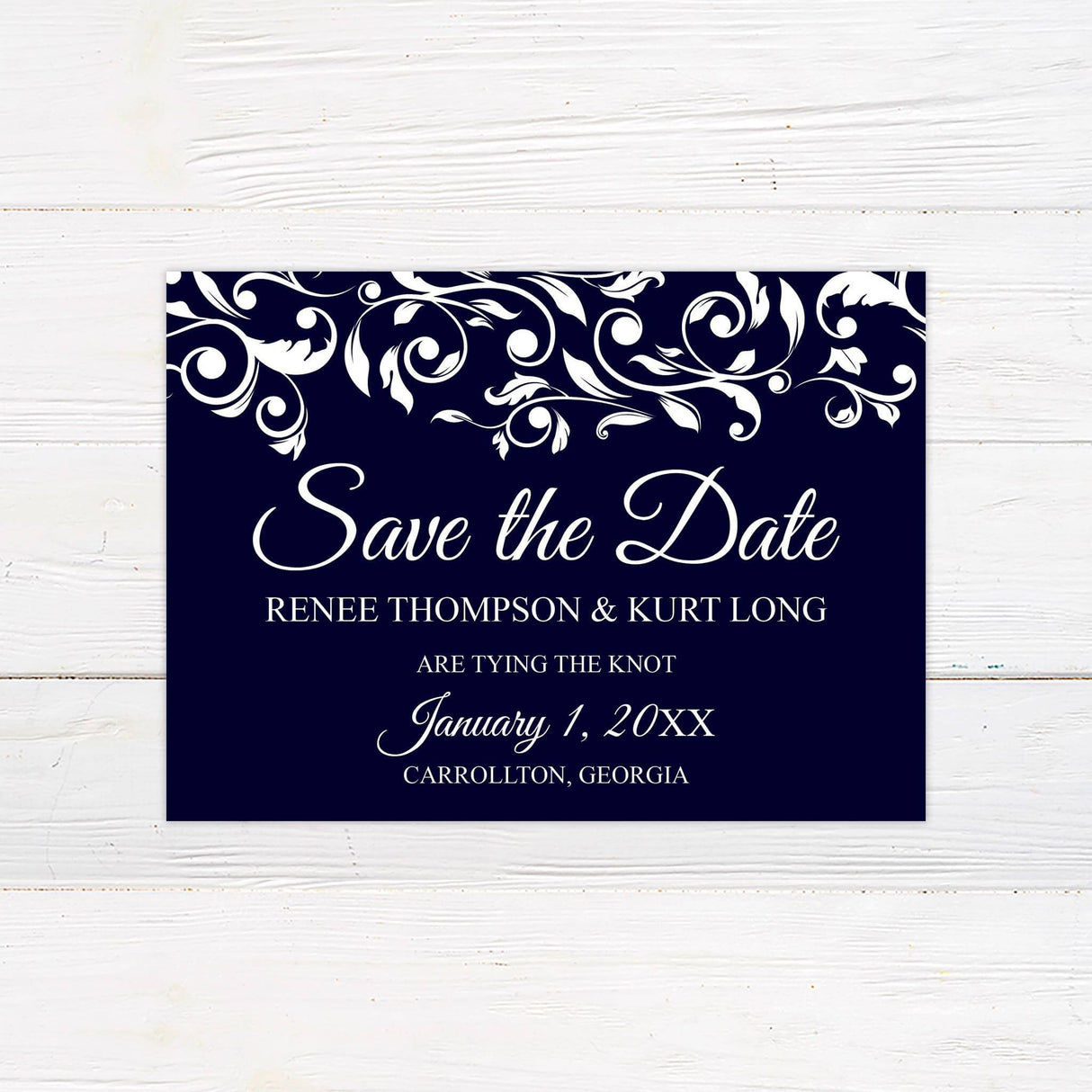 Coordinated Save the Date card with matching navy and white color palette and floral scrolls.