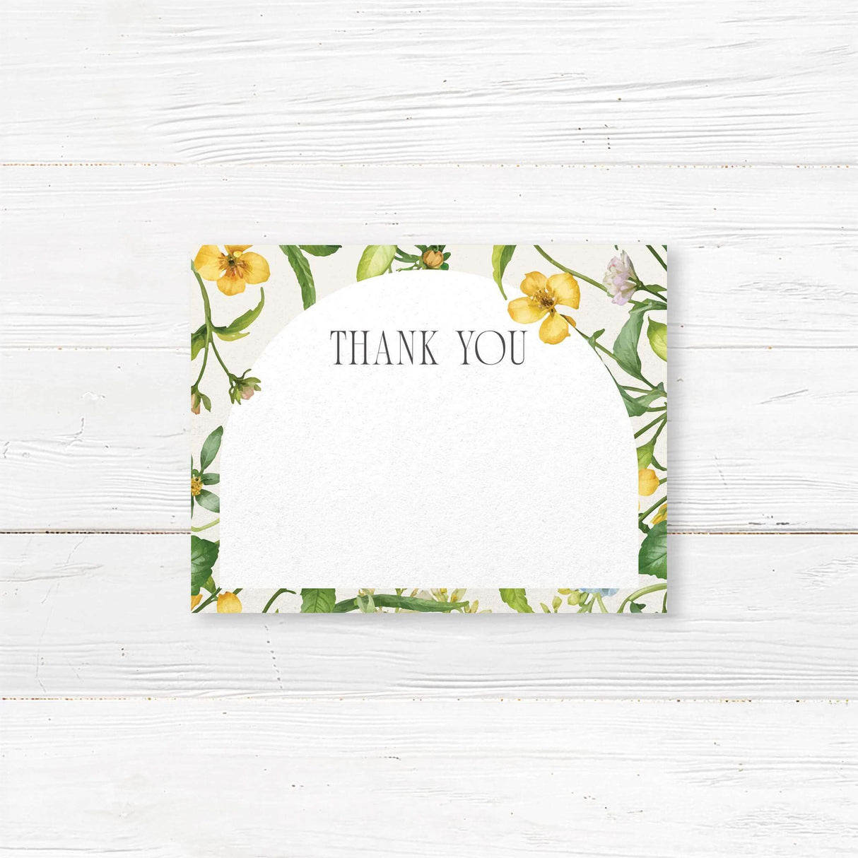 Bridal shower thank you card featuring a delicate wildflower arch design. Elegant script with space for a handwritten note or pre-printed message, perfect for expressing gratitude after a garden or tea party-themed shower.