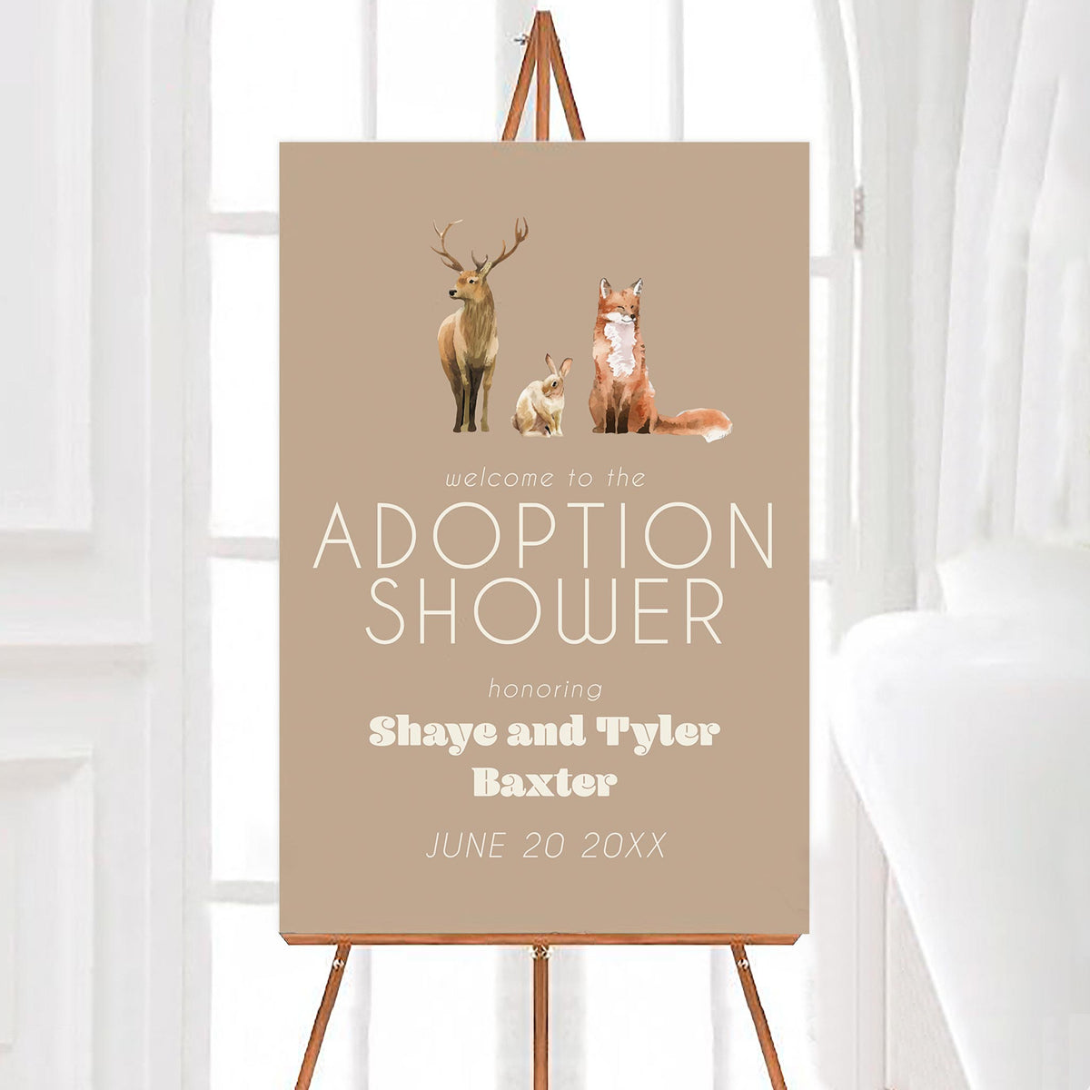 A wildlife adoption welcome sign featuring painted illustrations of a deer, rabbit, and fox on a brown background.