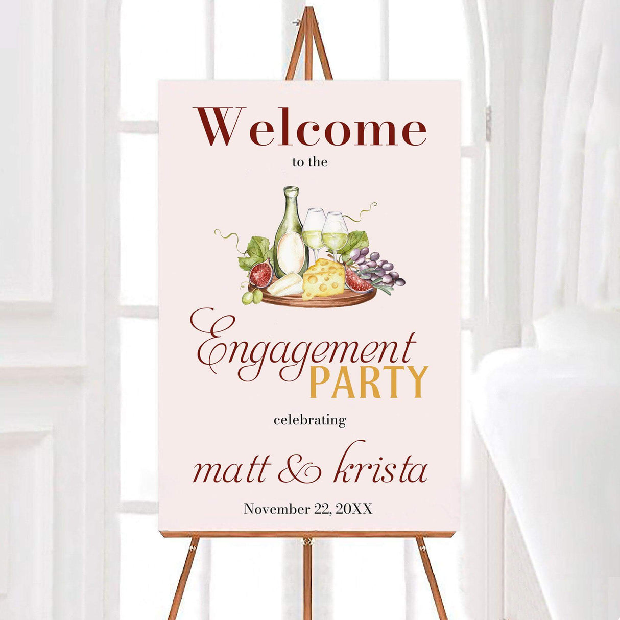 Wine and cheese engagement party invitation on easel setting elegant celebration tone with personalized details.