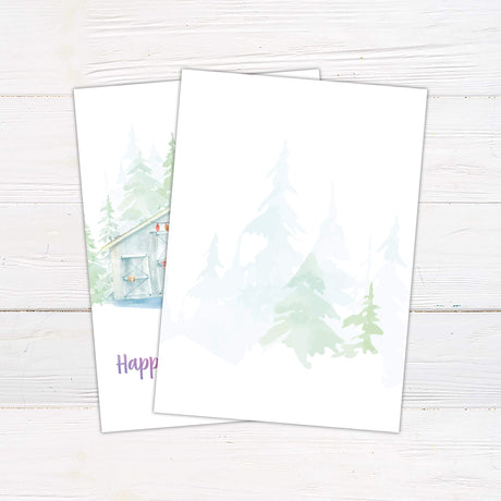 Watercolor holiday card featuring a snowy barn with festive string lights, evergreen trees in the background, and "Wishing You a Happy Holiday Season" in gradient text. - back side