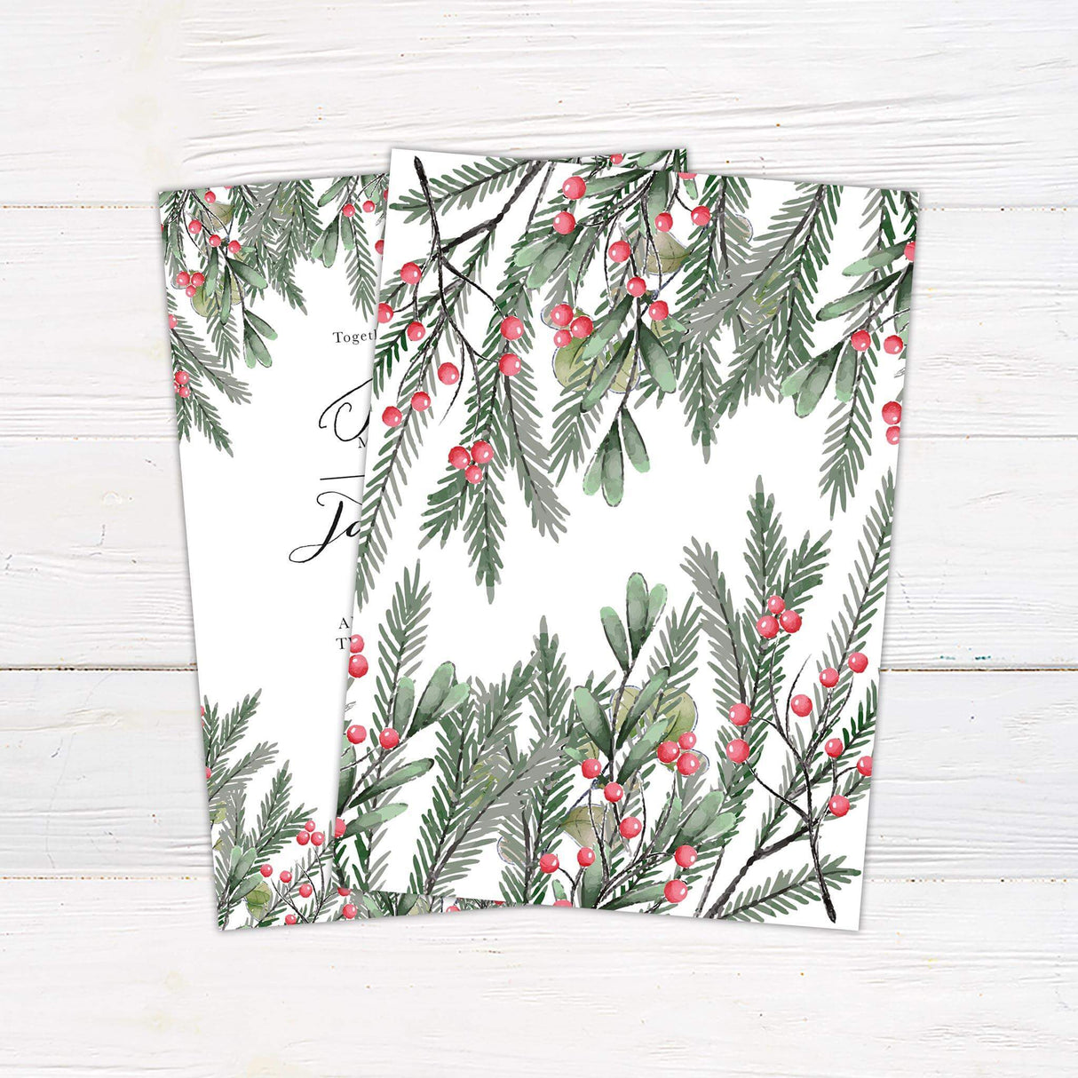 Wedding invitation featuring watercolor winter greenery and red berries with elegant calligraphy and serif fonts on white background.- back side