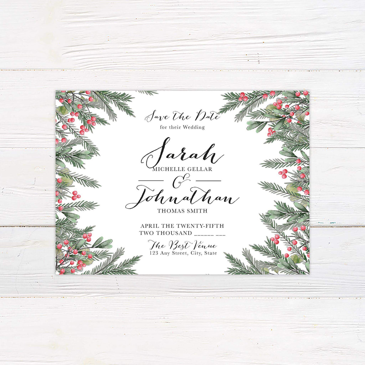 Save the Date card with seasonal greenery and bright red berries, perfect for winter weddings.