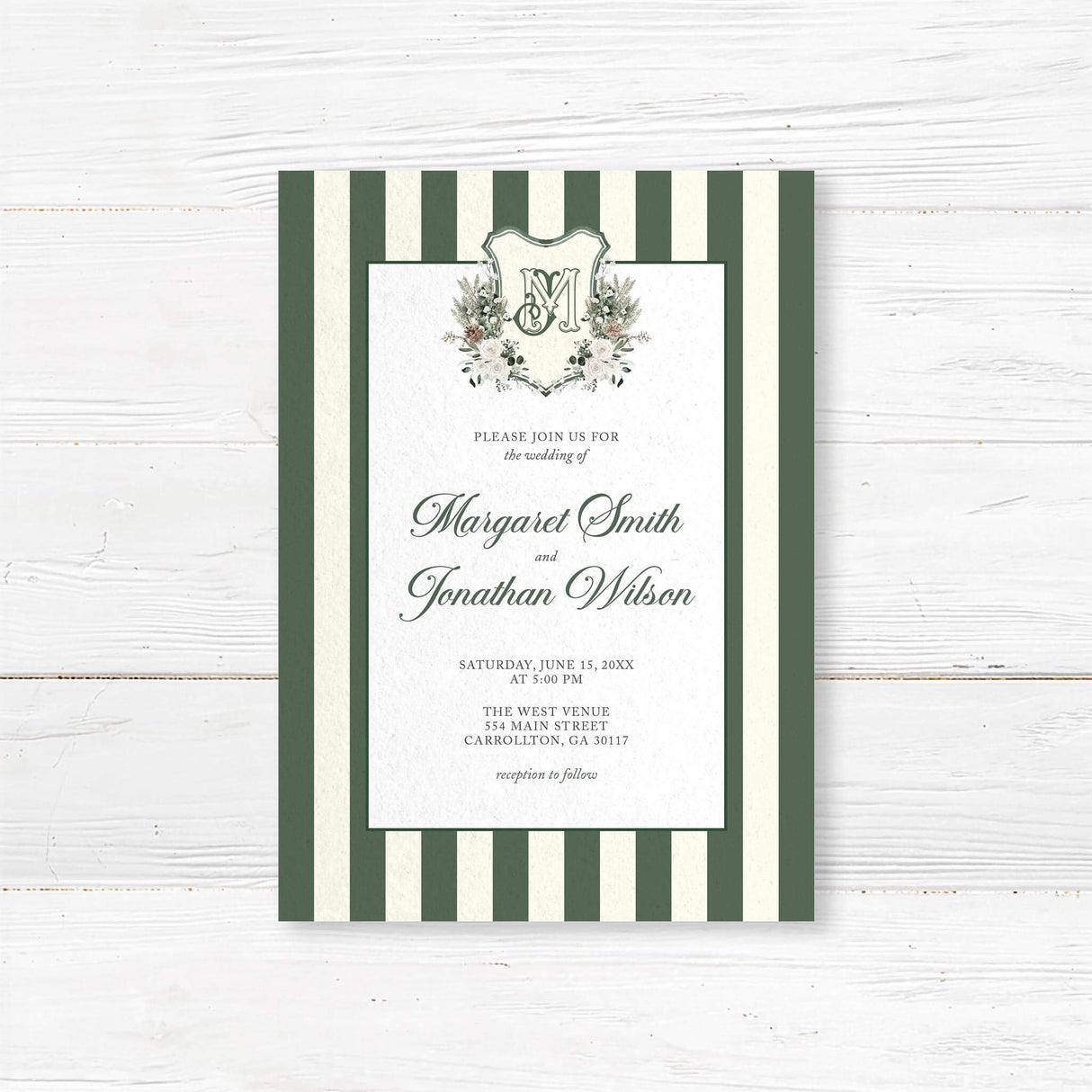 Winter wedding invitation featuring dark green and ivory vertical stripes, a white panel, floral monogram crest with greenery and roses, and elegant script and serif fonts for a formal winter wedding.