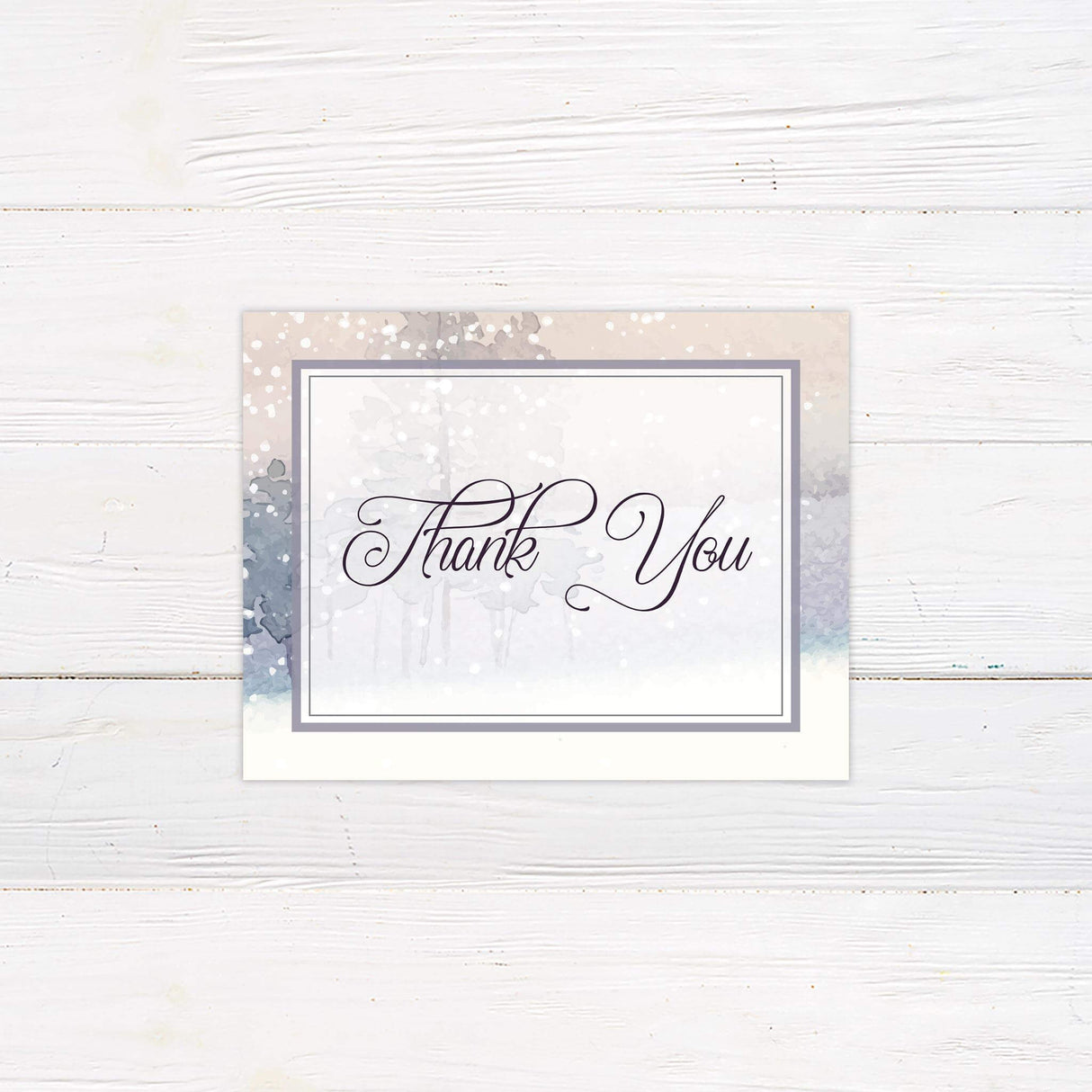 Thank you card featuring a snowy winter forest and graceful calligraphy.