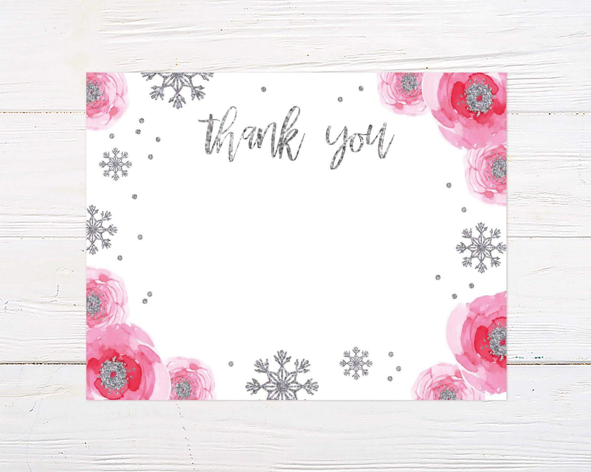 A thank-you card features large pink watercolor flowers and silver glitter snowflakes on a white background. The text "thank you" is written in a stylish metallic script at the top center.