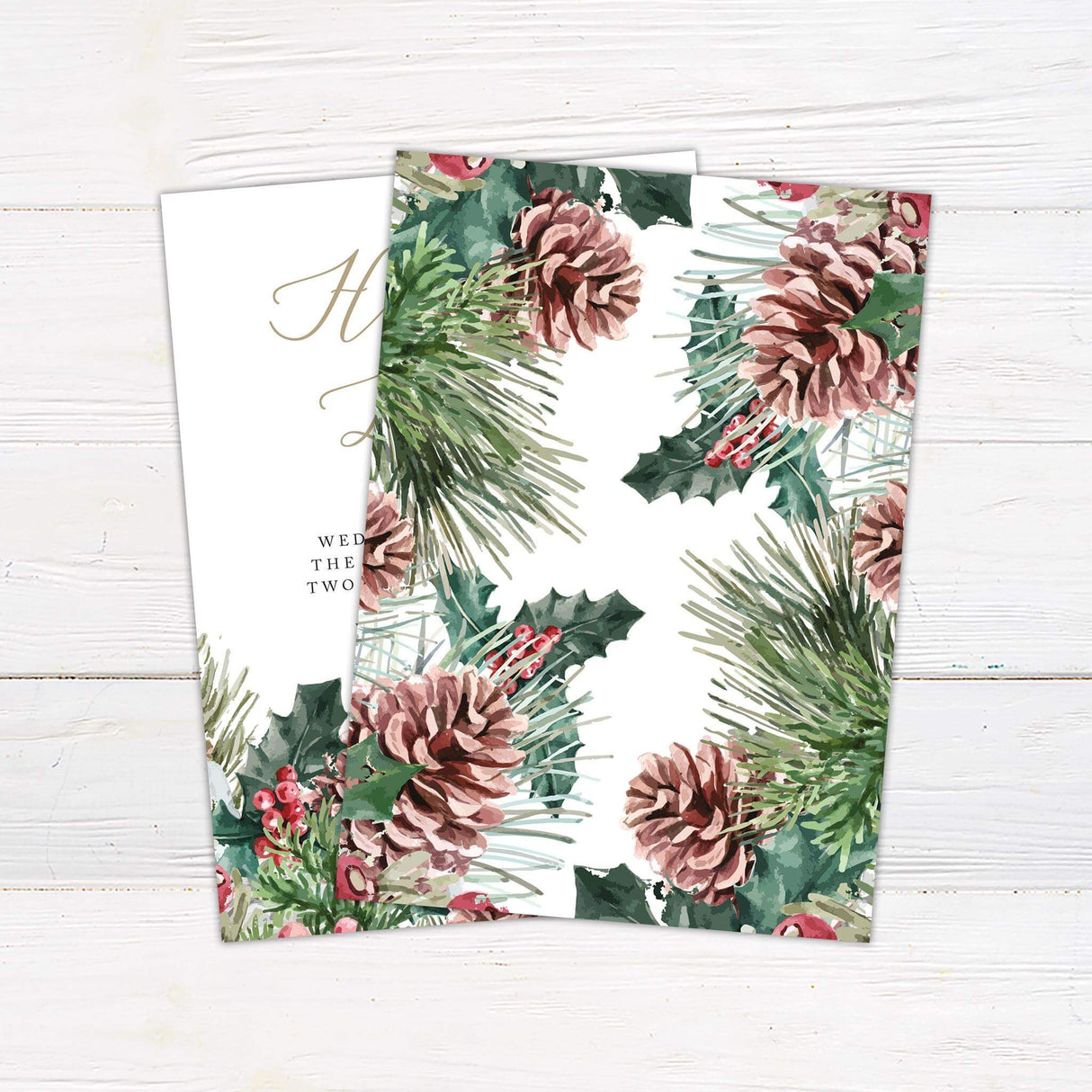 Rustic winter wedding invitation featuring watercolor pine cones, evergreen branches, red berries, and elegant script. - back side